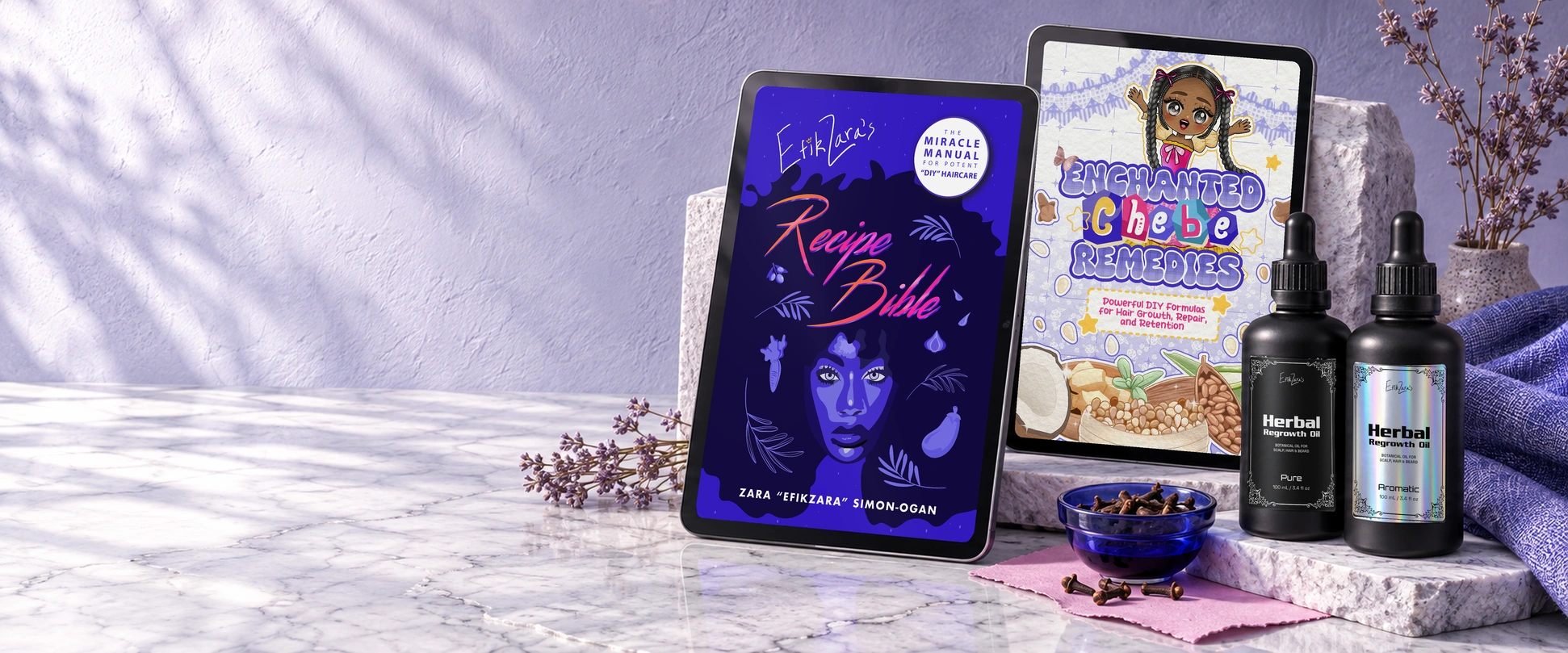 EfikZara’s Recipe Bible and Enchanted Chebe Remedies on iPads, with Pure and Aromatic Herbal Regrowth Oil, blue glass, lilac linen and tactile stone.