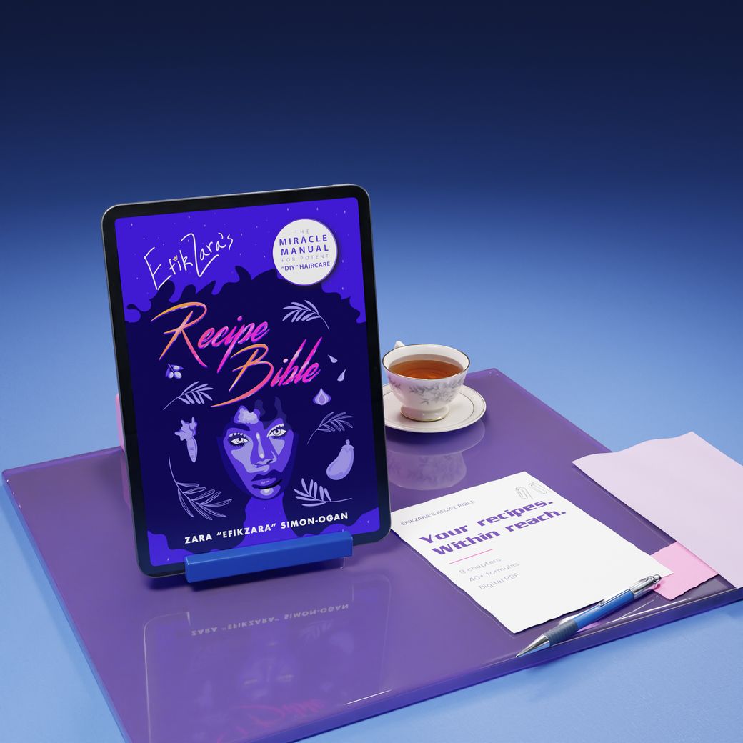 The Recipe Bible cover on an iPad in a violet acrylic studio with tea and textured stationery