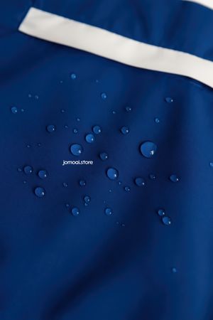 Blue waterproof textile with white stripe and droplets