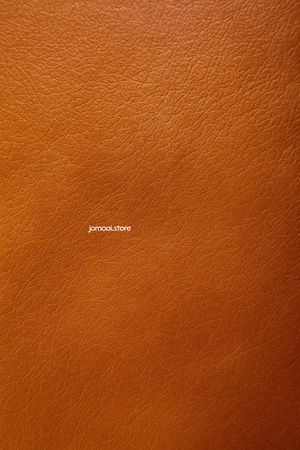 Textured brown synthetic leather surface close-up