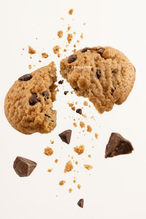 Chocolate chip cookie explosion with flying crumbs