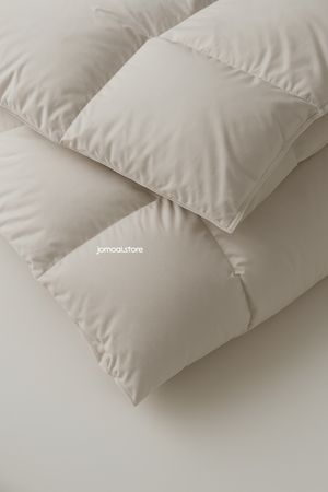 Beige Down Comforter Close-Up – Minimal Soft Bedding Texture