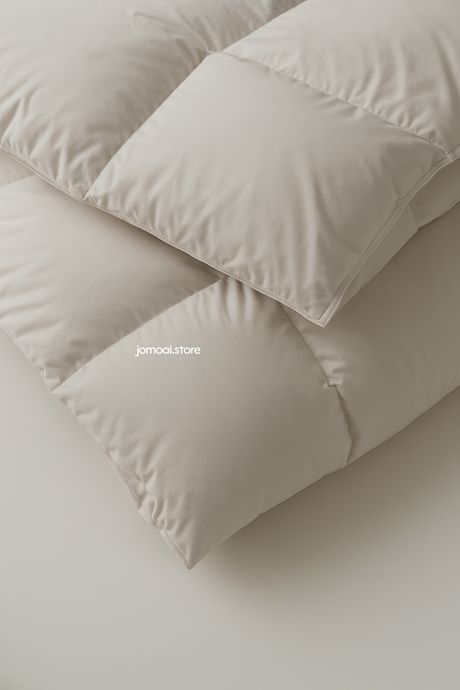 Beige Down Comforter Close-Up – Minimal Soft Bedding Texture