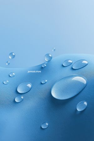 Water droplets on blue waterproof fabric surface