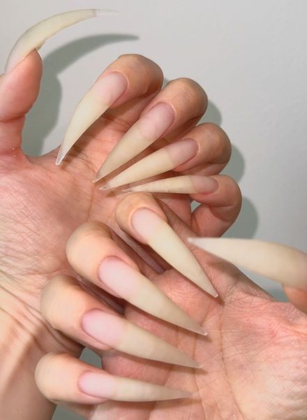 Scratching the wall with my razor-sharp natural nails, creating a piercing beautiful sound