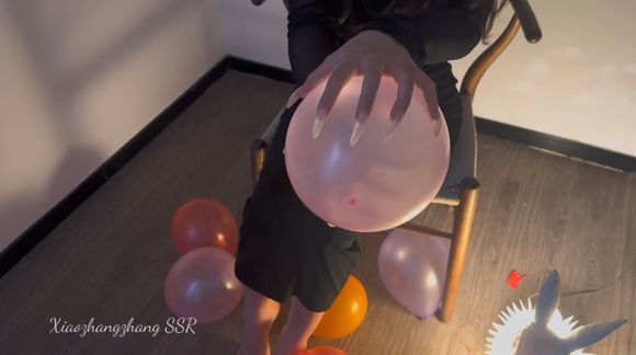 Popping balloons with my long nails