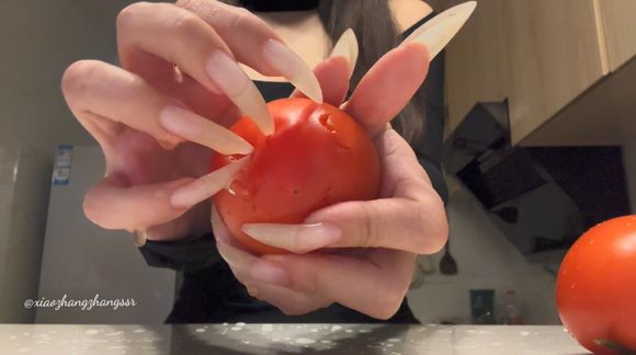 Destroying tomato with my long nails