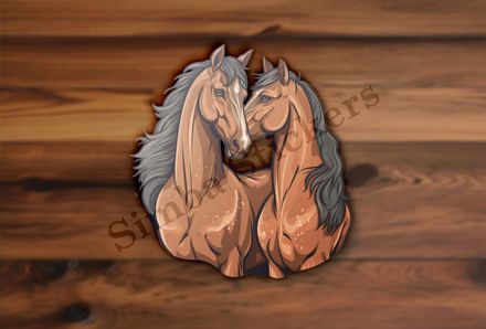 Two brown horses snuggling
