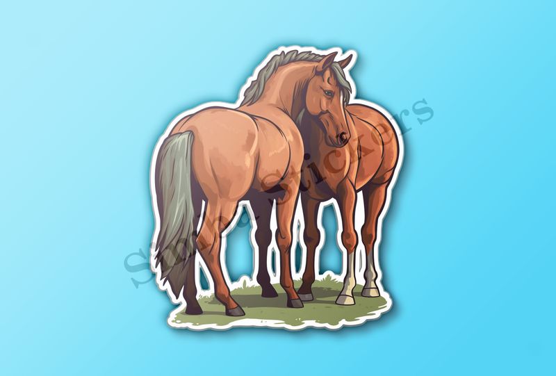 Two brown horses on green grass