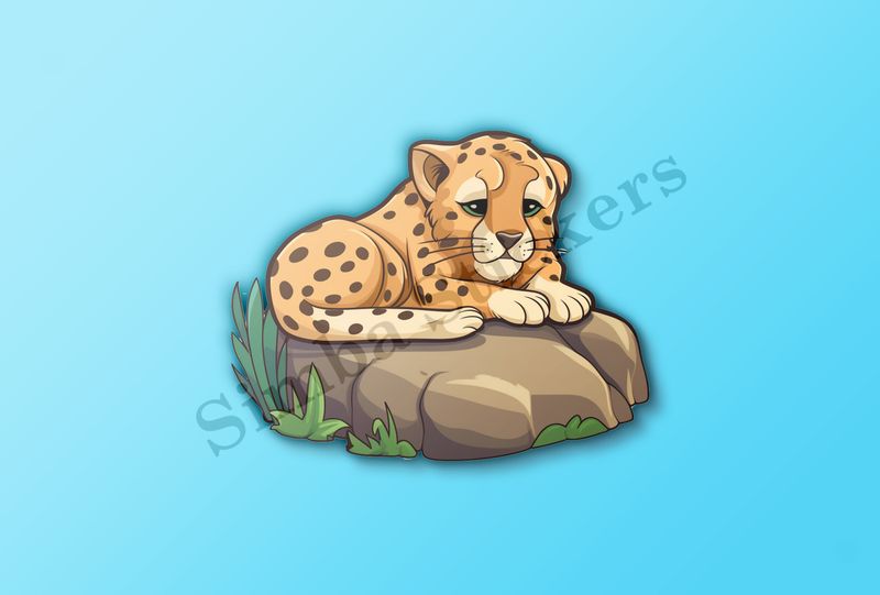 Baby cheetah on a leafy rock