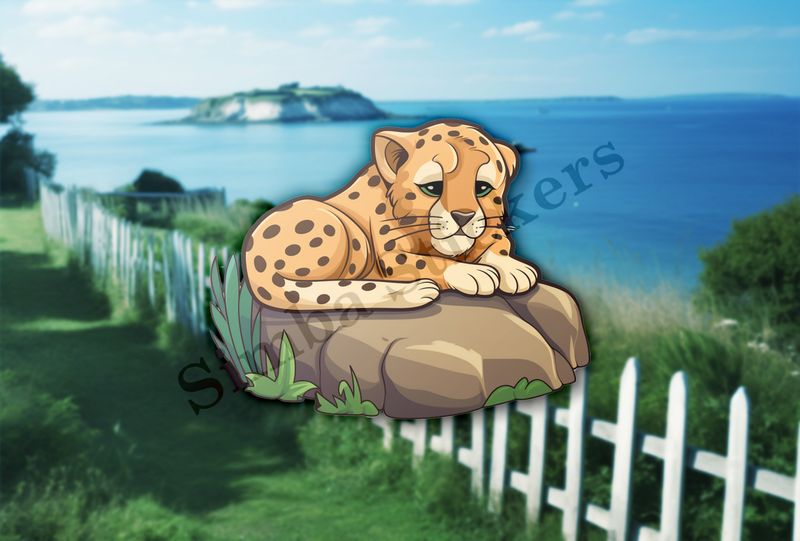 Baby cheetah on a leafy rock