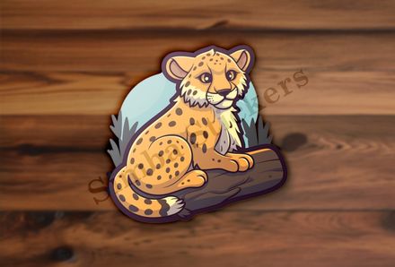 Baby cheetah on a log