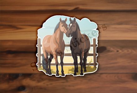 Two brown horses by a fence