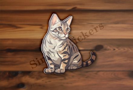 Bengal cat sitting and glancing sideways