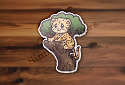 Leopard cub in a tree