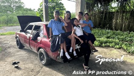 817 - 5 students having fun with old Corolla