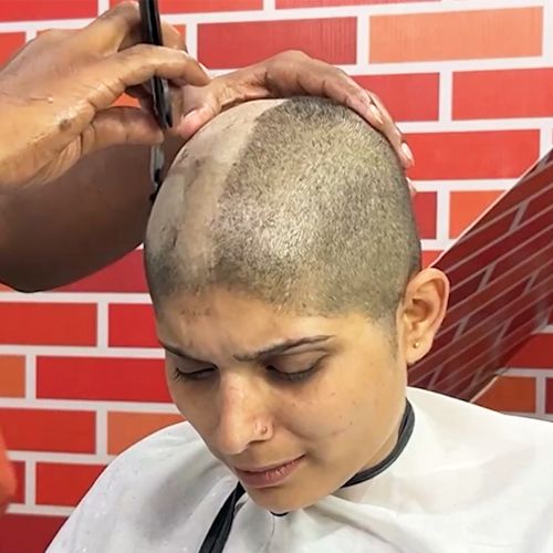 Forced headshave for crying student
