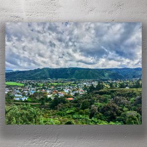 Scenic Aerial View of Upper Hutt New Zealand with Lush Green Hills and Cloudy Sky Photo Download