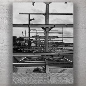 Symmetry of Rusted Boat Racks at Urban Waterfront Black and White Industrial Photo Download