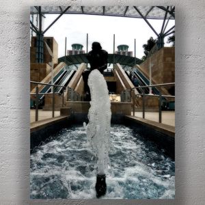 The Thinker Statue with a Bubbling Water Fountain Photo Download