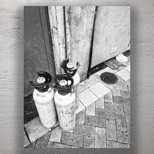Urban Still Life Black and White Photo of Gas Cylinders on City Sidewalk Photo Download