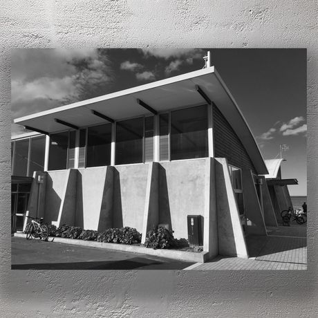 Modern Coastal Building with Angular Concrete Architecture and Ocean View Photo Download