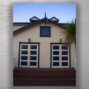 Historic Coastal Building with Symmetrical Blue Double Doors Photo Download