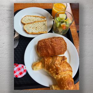 Delicious French Breakfast with Croissants Pastries, and Fresh Juice Photo Download