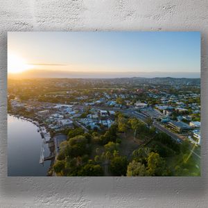 Aerial Sunrise View of Mowbray Park and Brisbane Suburbs by the River Photo Download