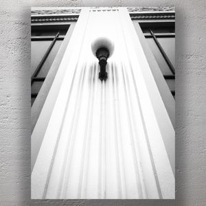 Art Deco Wall Lamp on Ornate Facade Symmetrical Architectural Detail Photo Download