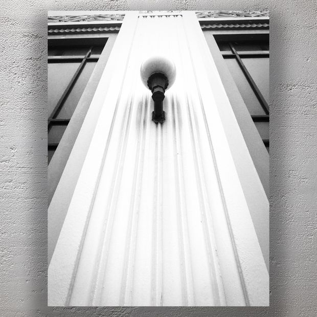 Art Deco Wall Lamp on Ornate Facade Symmetrical Architectural Detail Photo Download