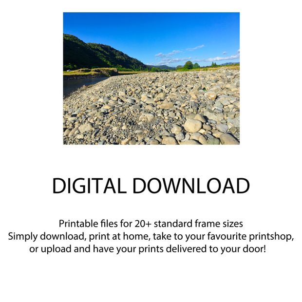Rocky Riverbank Landscape Tranquil Nature View with Blue Sky and Green Hills Photo Download
