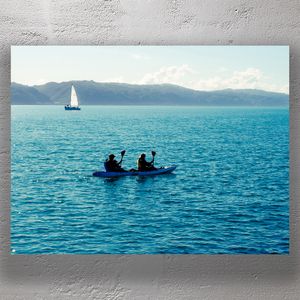 Kayaking on Wellington Harbour with Distant Sailboat and Mountain Views Photo Download