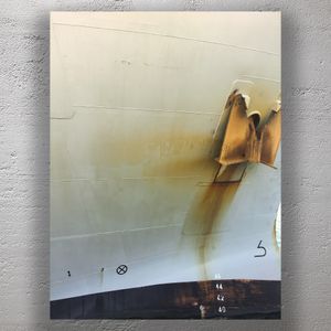 Rust-Stained Ship Hull with Anchor and Waterline Markings at Dockside Photo Download