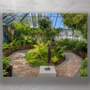 Lush Greenhouse Oasis with Botanical Pathway and Sculpture Photo Download