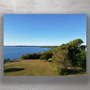 Scenic Ocean View Park with Lush Greenery and Blue Waters Tranquil Coastal Landscape Photo Download