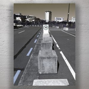 Urban Speed Limit Sign in Cityscape Concrete Barrier Perspective 10 kmh Road Sign Photo Download