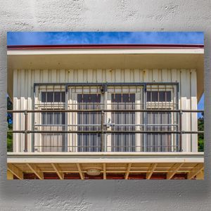 Rustic Beachfront Shed with Barred Windows Coastal Architecture Photography Photo Download