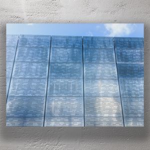 Modern Perforated Metal Facade with Sky Reflection Contemporary Architectural Photo Download