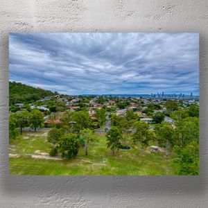 Scenic Aerial View of Brisbane Suburb with Lush Parkland and City Skyline Photo Download