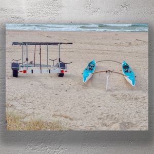 Twin Outrigger Canoes on Sandy Beach with Trailer by the Ocean Photo Download