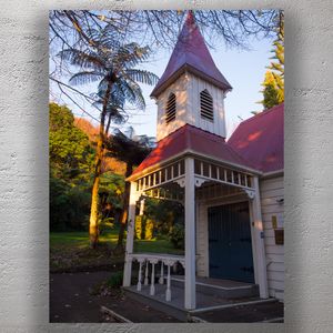 Historic Wooden Chapel at Sunset in Lush Forest Setting Photo Download
