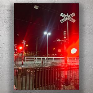 Nighttime Railway Crossing with Warning Lights and Gates Photo Download