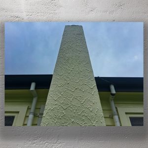 Textured Stucco Chimney Against Cloudy Sky Architectural Close-Up Photo Download
