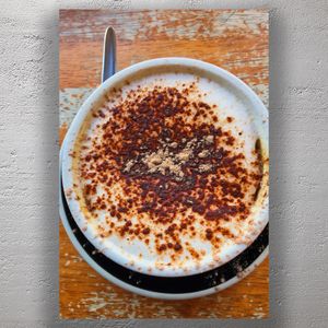 Frothy Cappuccino with Cocoa Powder Topping on Rustic Wooden Table Photo Download