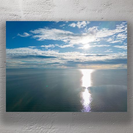Tranquil Ocean View with Stunning Sunlight Reflection Serene Seascape Photo Download