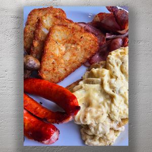 Ultimate Full English Breakfast Crispy Hash Browns Scrambled Eggs Bacon and Sausages Photo Download