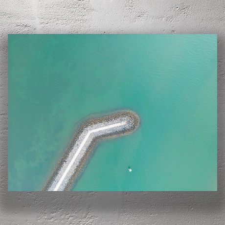 Aerial View Breakwater Clear Turquoise Ocean and Rocky Pier Photo Download