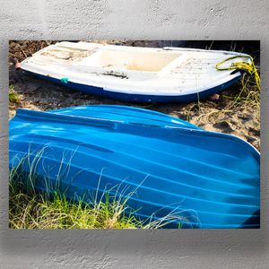 Beached Rowboats in Sunlight Blue and White Dinghies on Sandy Shoreline Photo Download