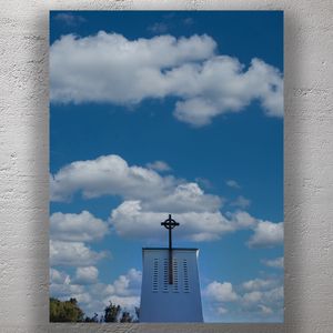 White Church Tower with Cross Under Cloudy Blue Sky Peaceful Christian Architecture Photo Download